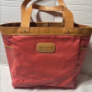 Jon Hart East-West coated canvas tote with leather trim and inside zip pocket.